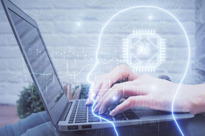 A glowing digital brain rising from a laptop keyboard.