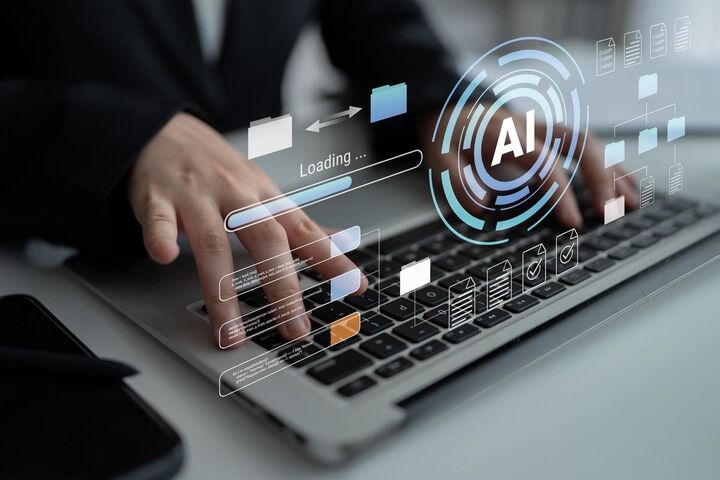 Hands on a laptop beneath a floating AI chip.