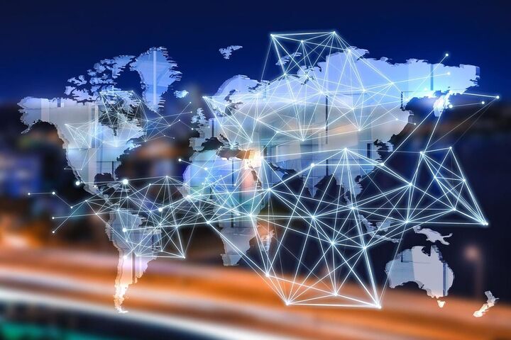 A glowing mesh of network lines over a world map.