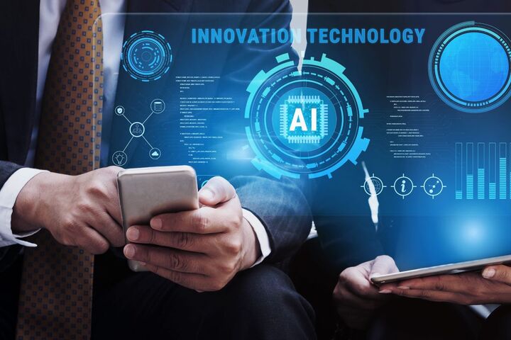 A hand holding a tablet showing an AI interface.