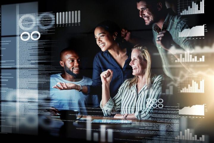 A group of software developers at their desks.